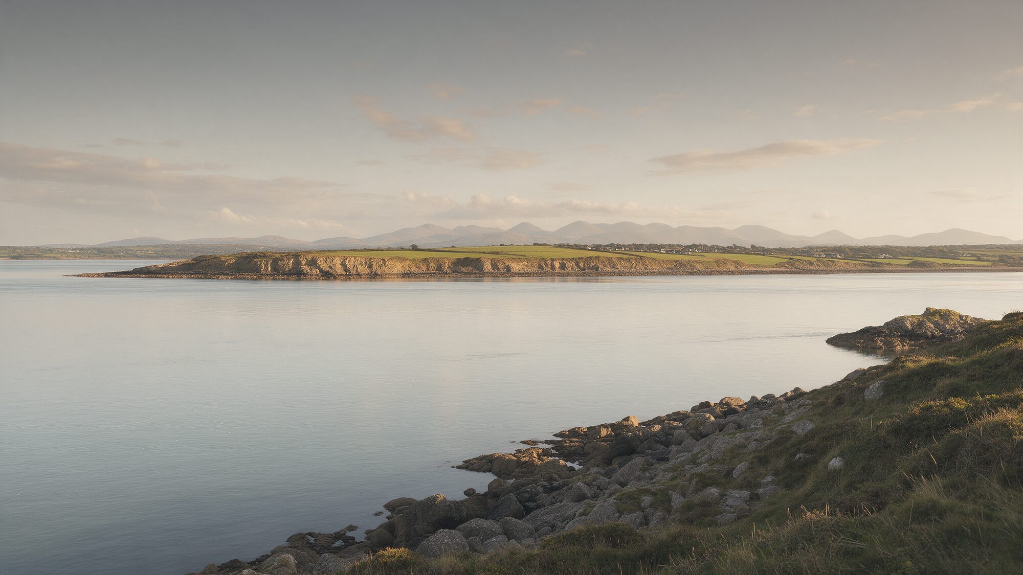 The Menai Strait and Anglesey coastline in evening light